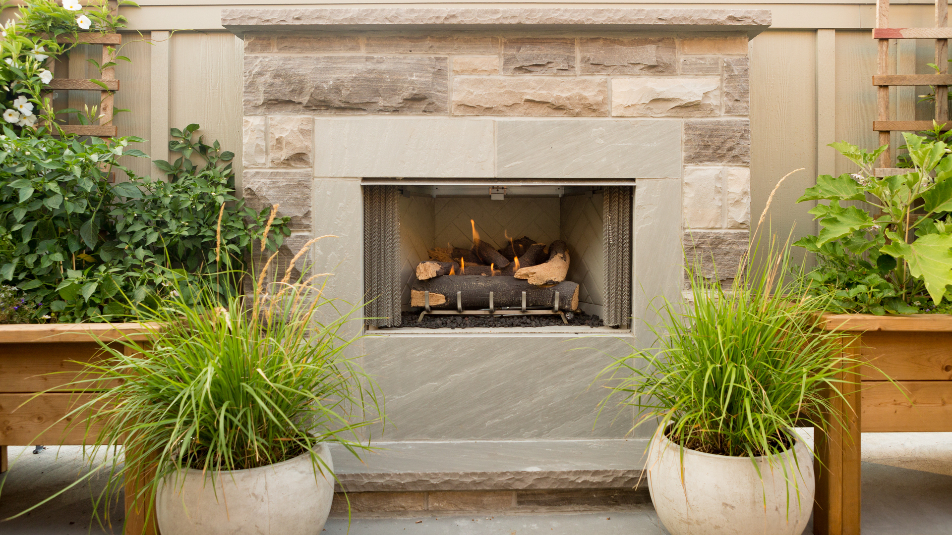 Close up on a wood burning outdoor fireplace installed on a property in Long Island, NY.