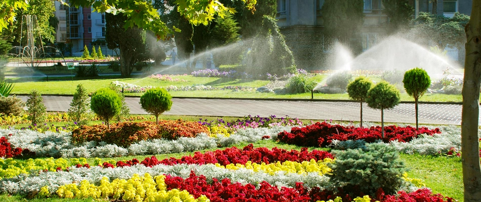 A commercial property with vibrant landscaping and an irrigation system in Harlem, NY.