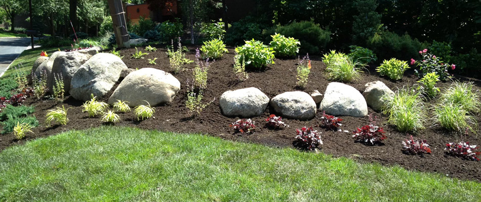 Landscape bed installed with mulch and plantings in Allendale, NJ.