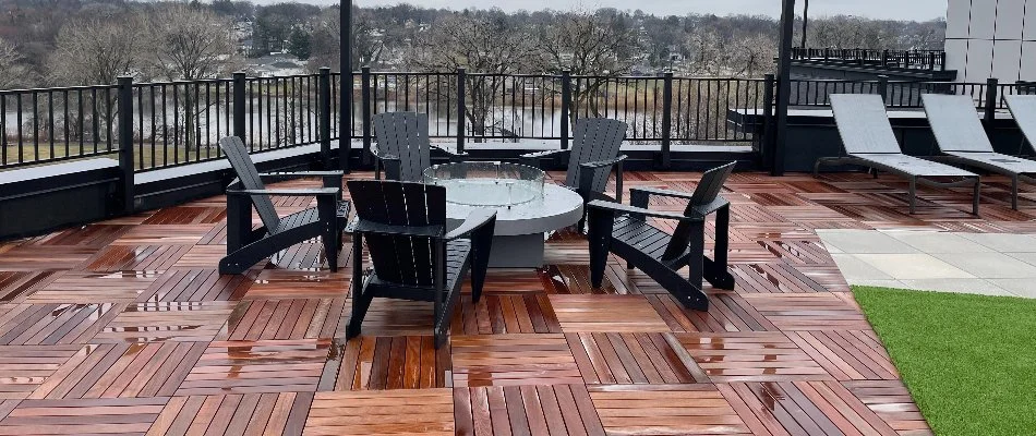 A patio made from concrete pavers and wood on a rooftop in Hackensack, NJ.