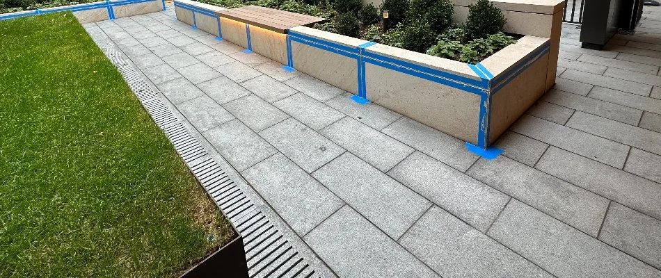 Paver walkway in Alpine, NJ, and an unfinished planter bed.