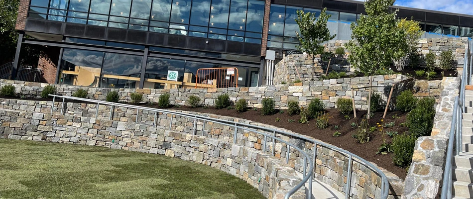 Retaining wall with landscape beds installed in The Bronx, NY.