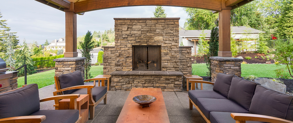 A wood burning outdoor fireplace constructed by our team on a property in Bridgeport, CT.