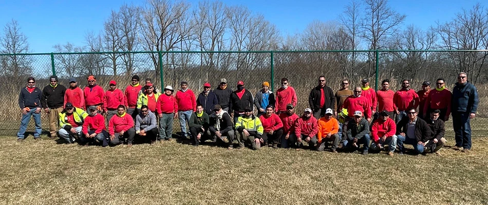 Work team photo in a yard in The Bronx, NY.